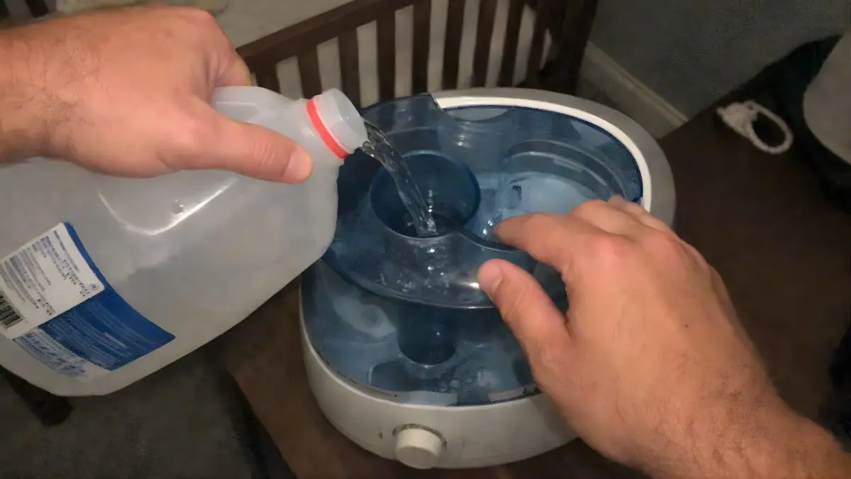 Dad demonstrating how to use humidifier for baby congestion safely