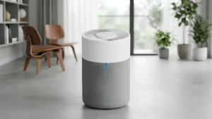 best air purifier for small apartment - A white Blueair 311i+ Max sitting quietly in the corner of a small modern apartment living room.